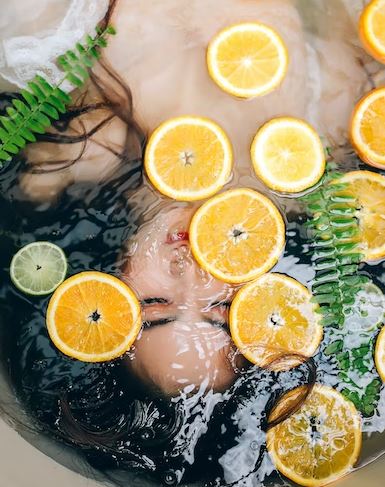 another image of woman with lemons on her face