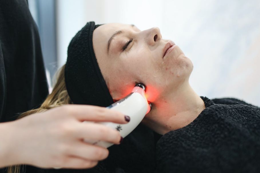 woman have a facial care using laser