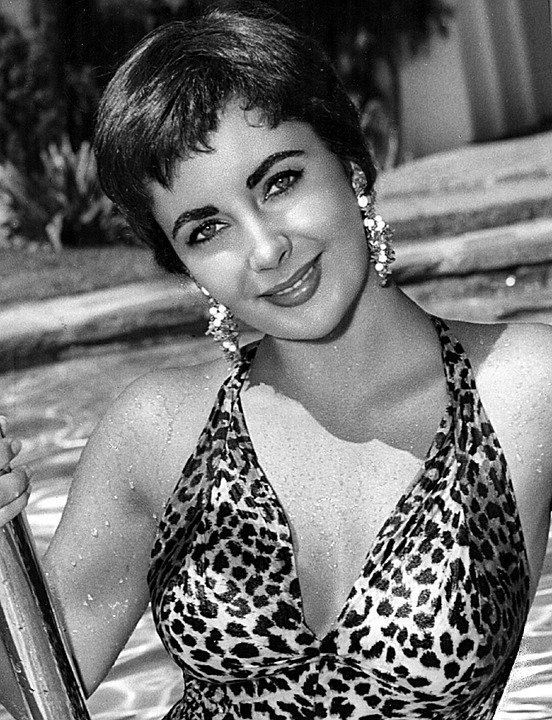 Elizabeth Taylor wearing a leopard print bathing suit