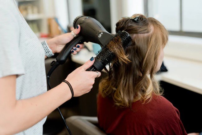 styling hair at the salon