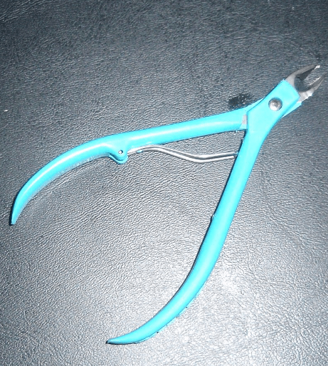 Many salons use a cuticle nipper although it is generally not advised. 