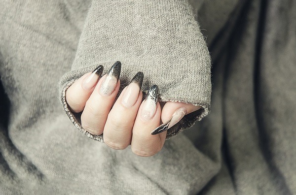 person with acrylic nails