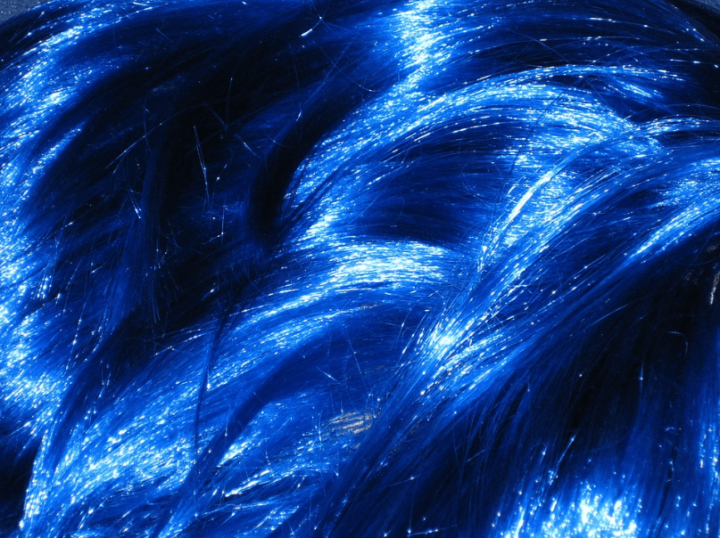a close up of a blue wig