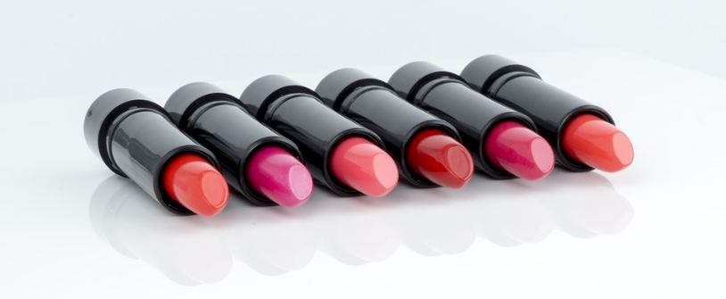 Different types of lipsticks placed on a white table
