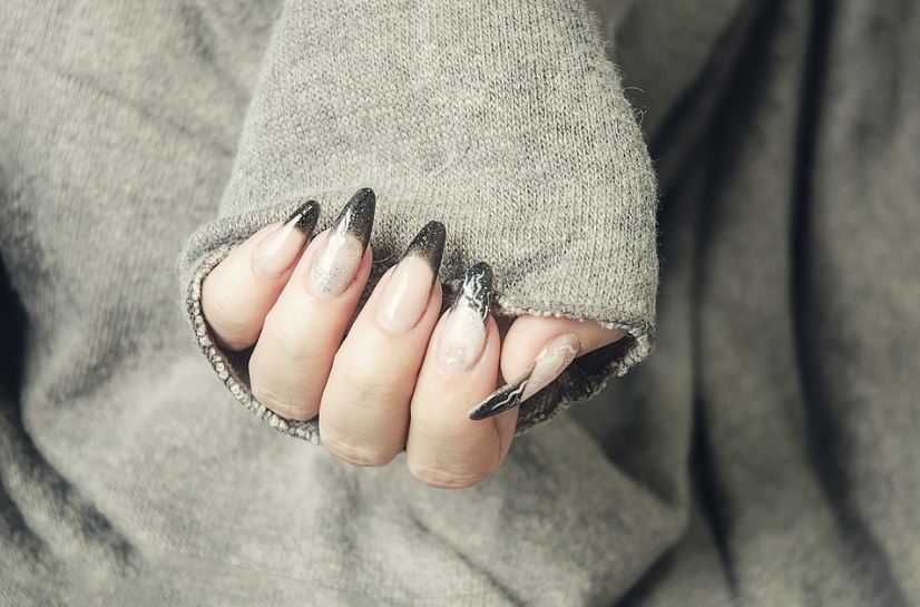 a model showing off their gel nails