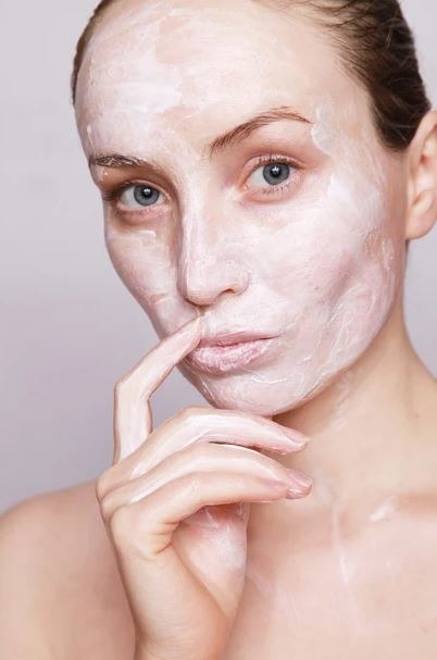 woman with cream on her face